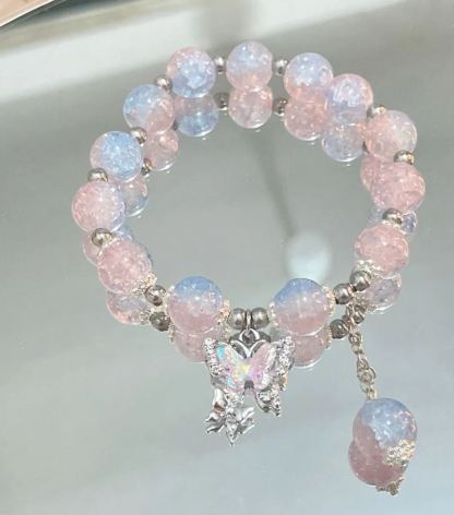 Pink, green, and blue butterfly glaze bracelets with silver charms, perfect for gifting.