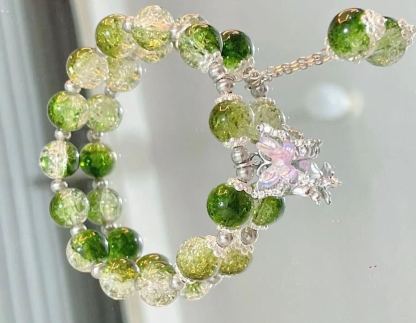 Pink, green, and blue butterfly glaze bracelets with silver charms, perfect for gifting.