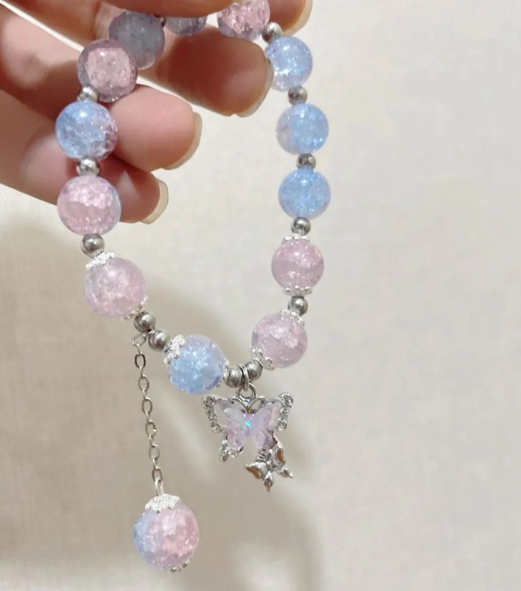 Pink, green, and blue butterfly glaze bracelets with silver charms, perfect for gifting.