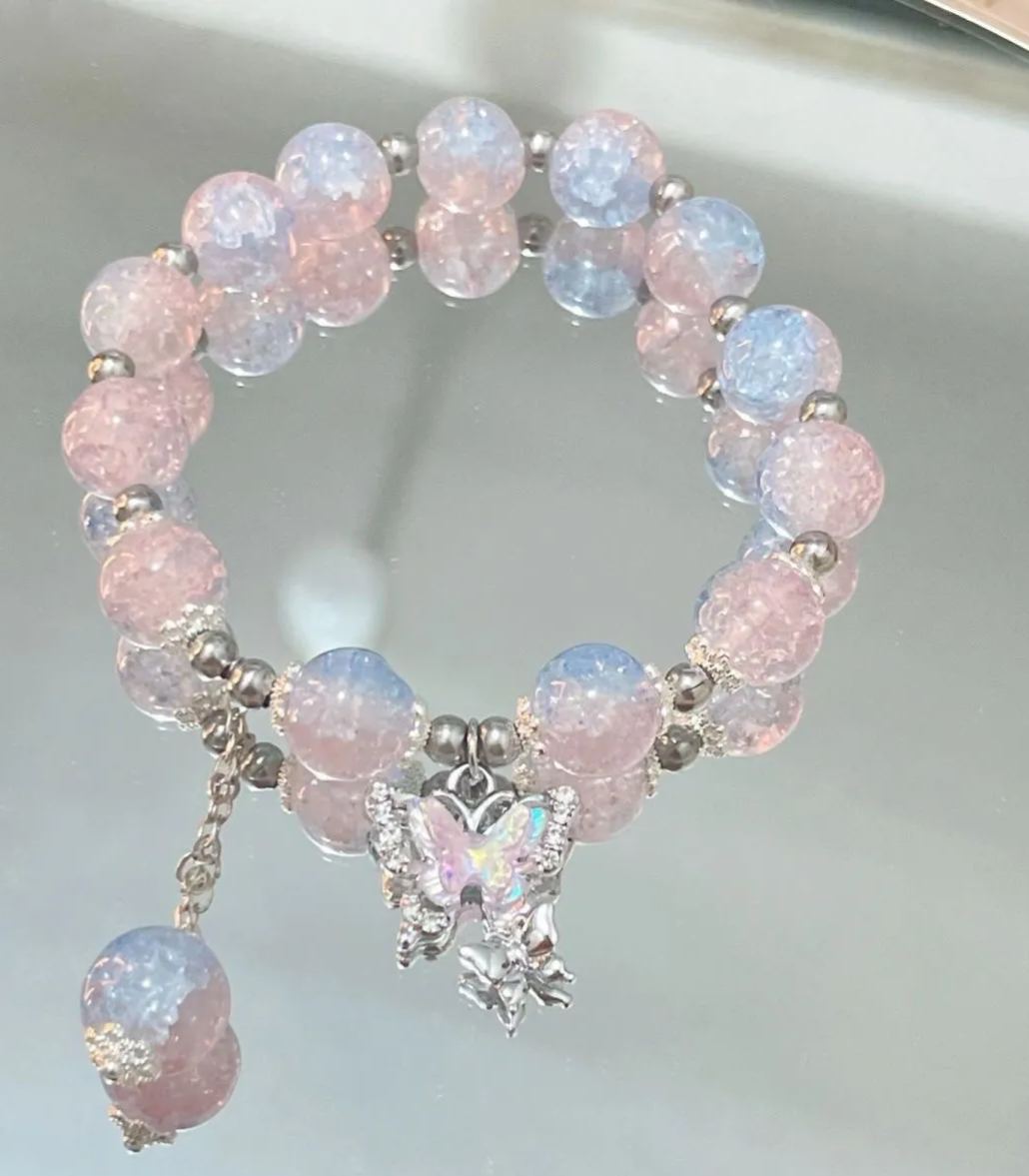 Pink, green, and blue butterfly glaze bracelets with silver charms, perfect for gifting.