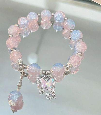 Pink, green, and blue butterfly glaze bracelets with silver charms, perfect for gifting.