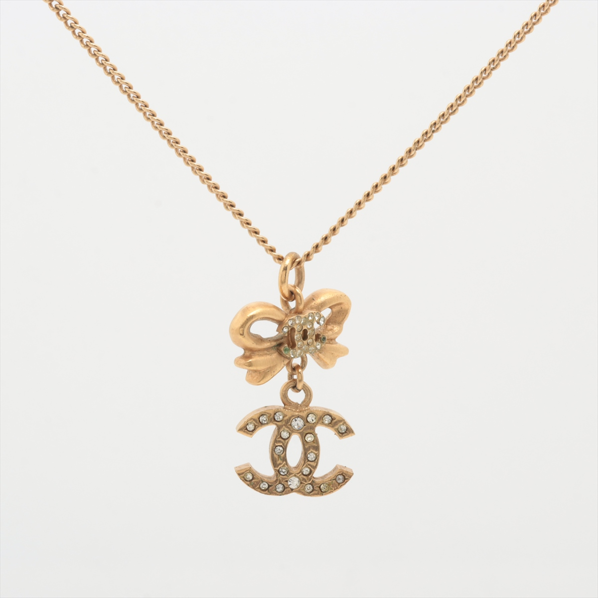 C Gold bow logo pendant necklace