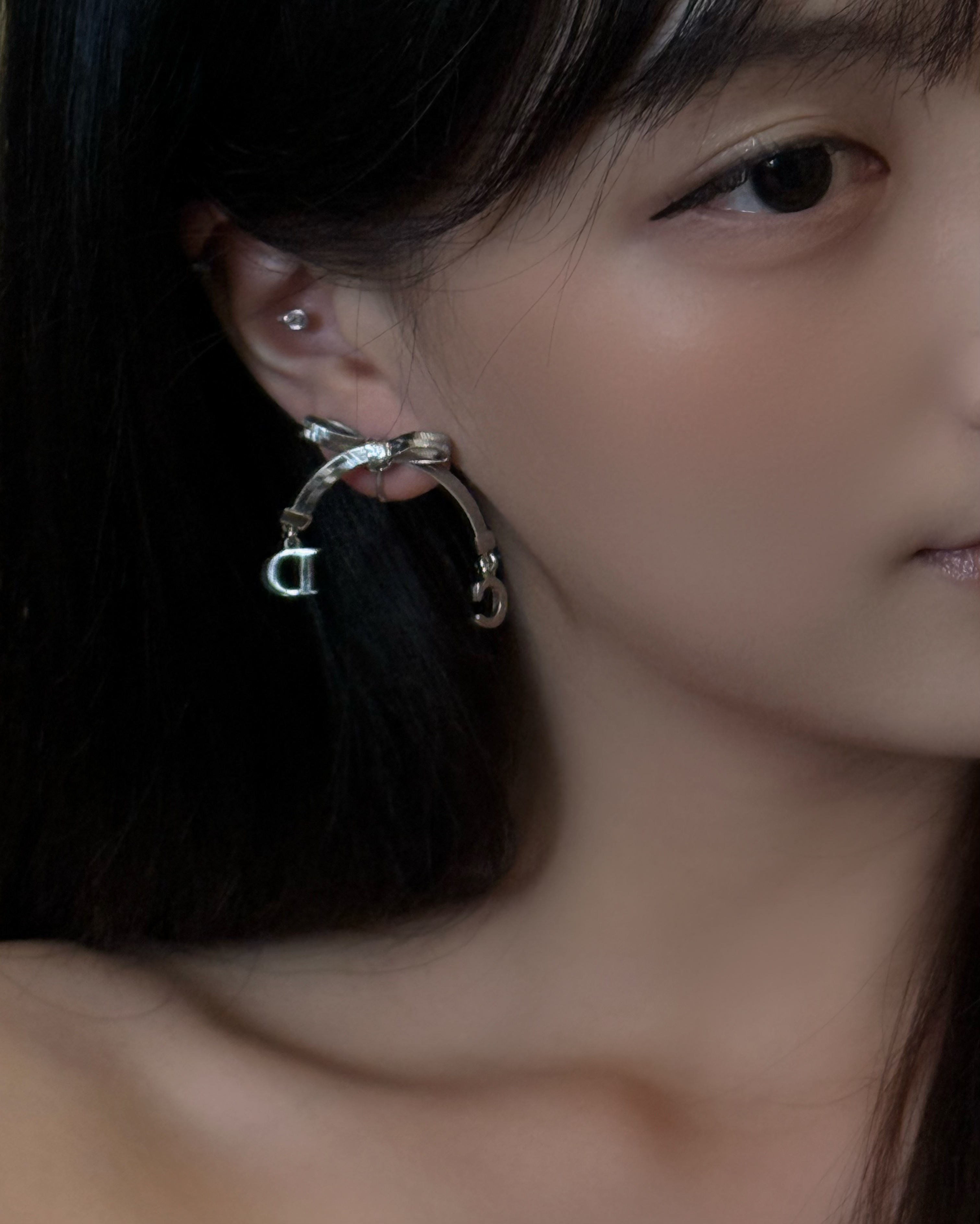 D silver bow earrings
