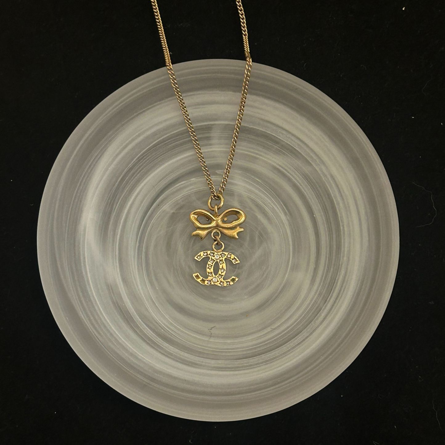 C Gold bow logo pendant necklace