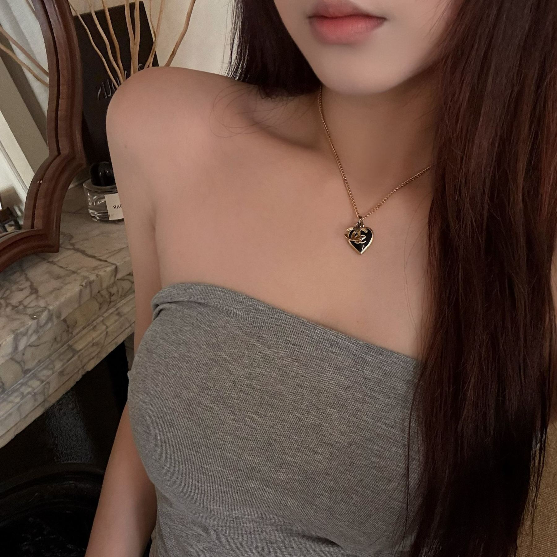 C Black and gold heart logo necklace