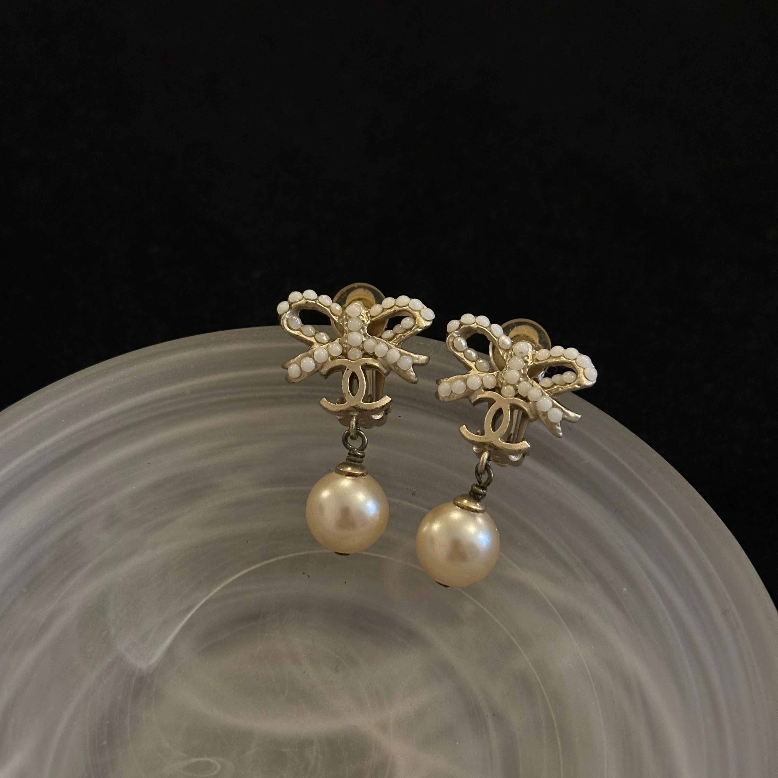 C Bow Pearl Ear Clips
