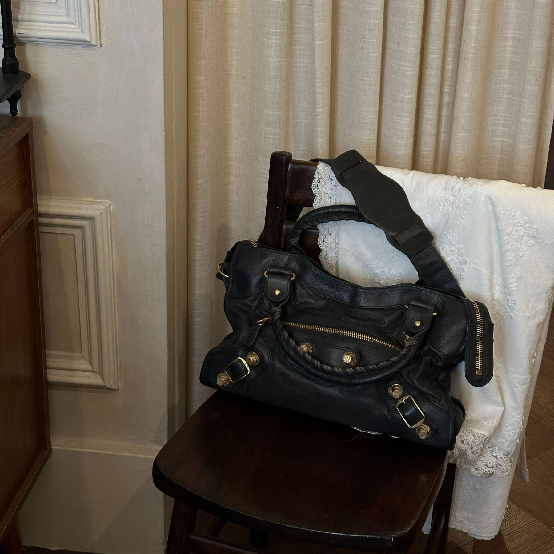 B Black and gold studded motorcycle bag