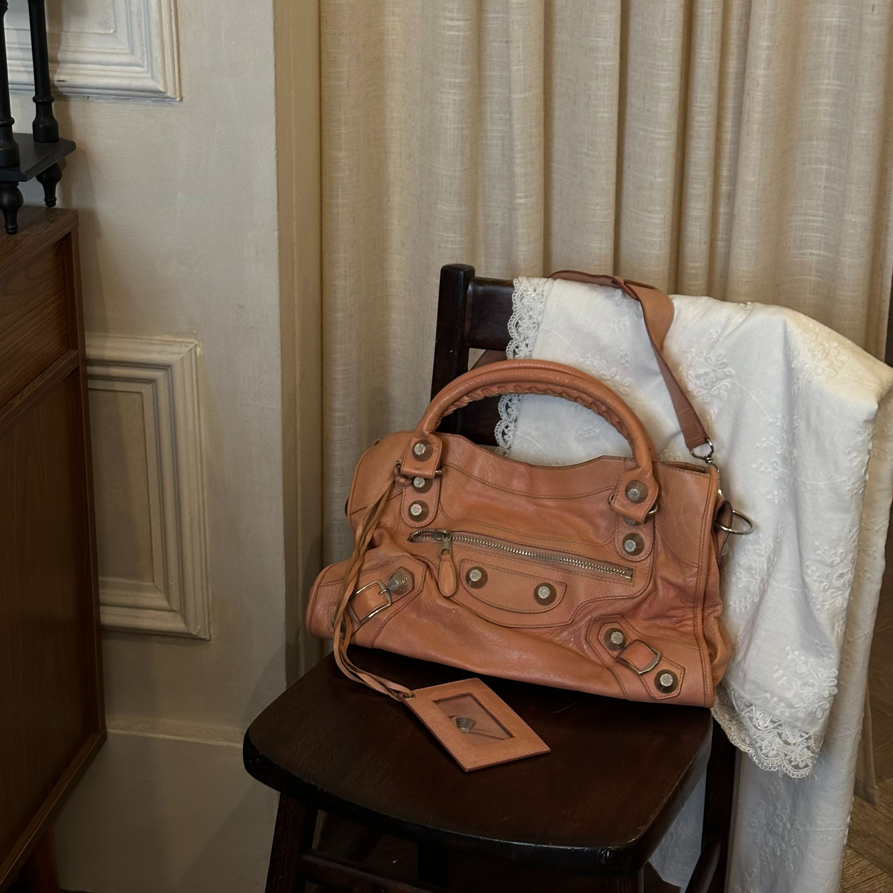 B orange studded motorcycle bag