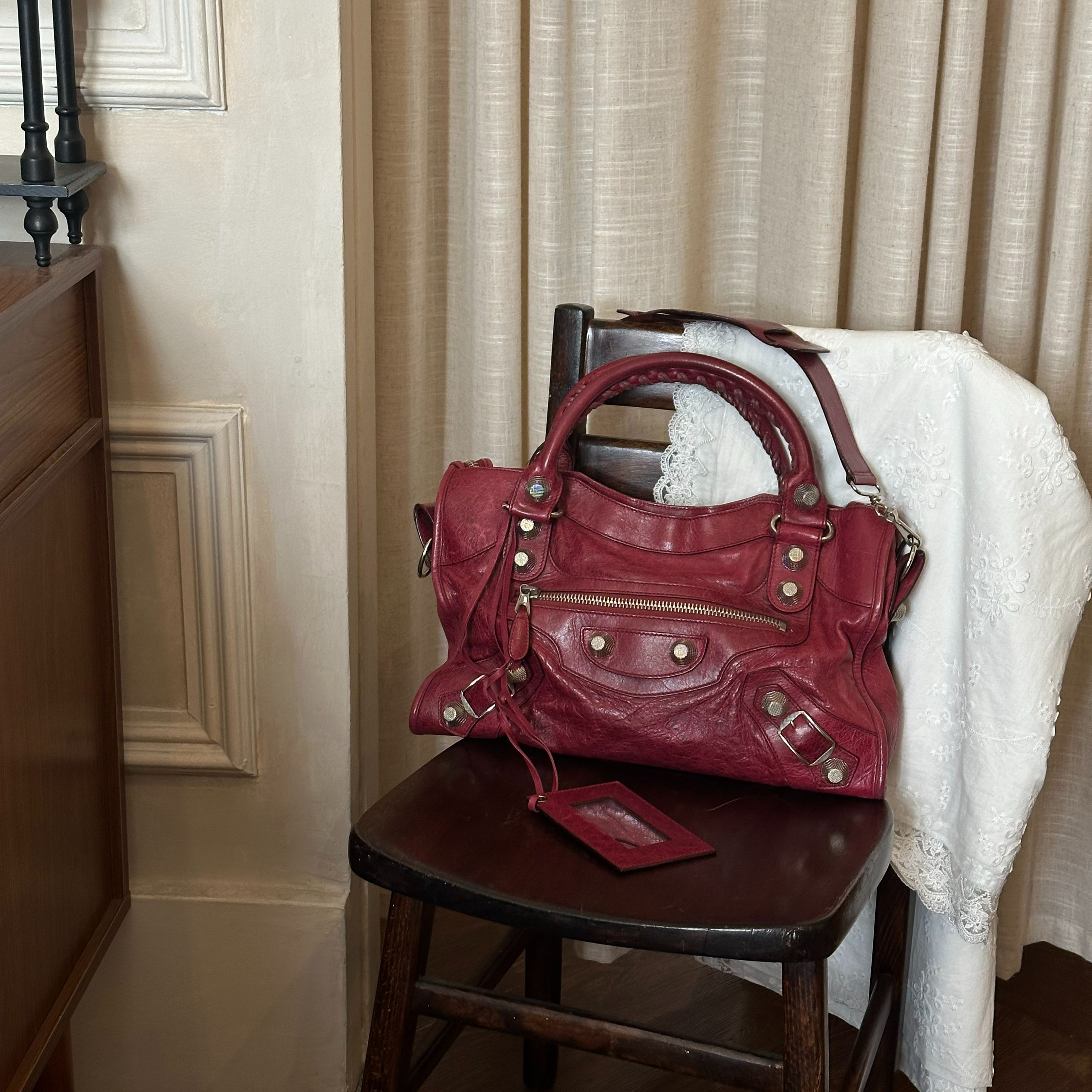 B Burgundy studded motorcycle bag