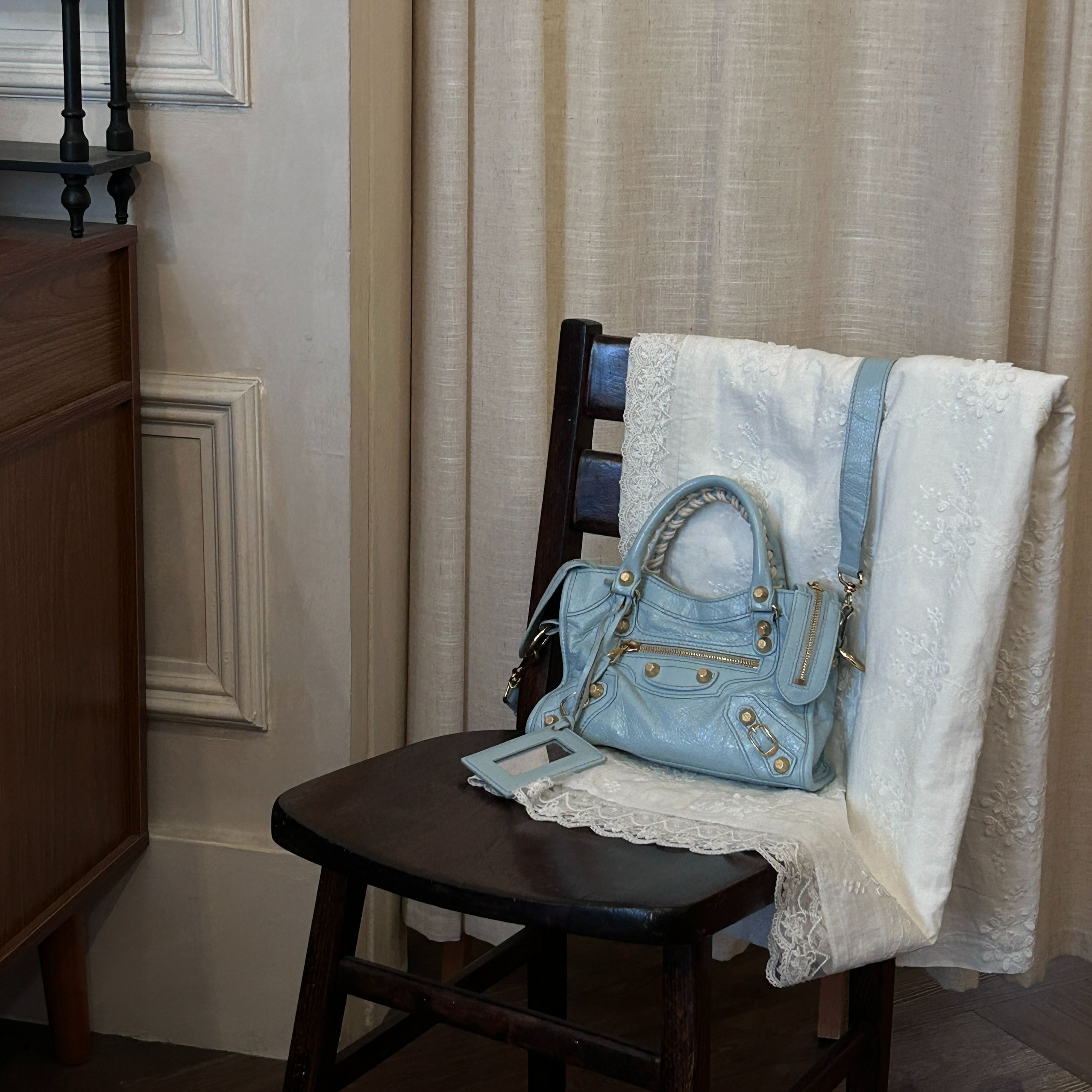 B Baby Blue studded mini motorcycle bag
