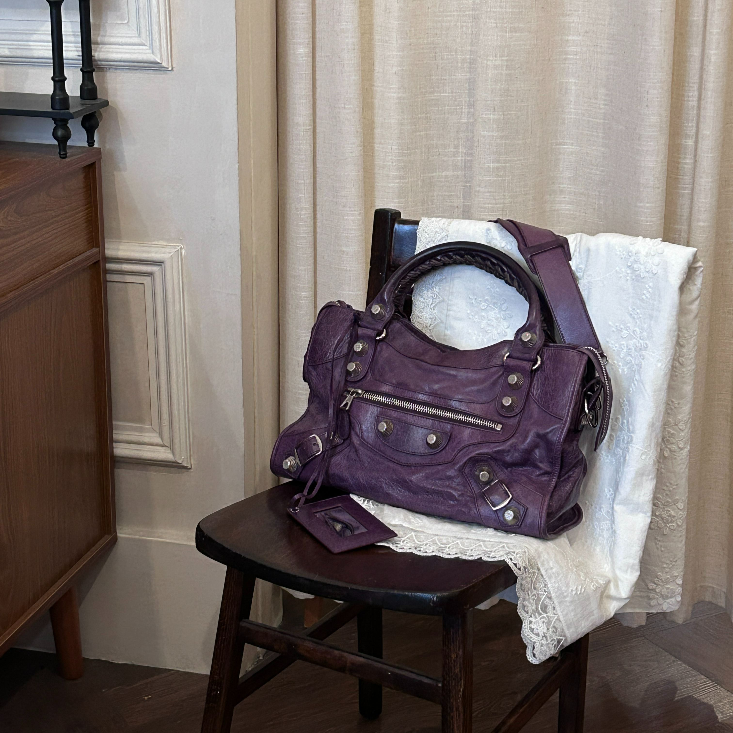 B Purple studded mini motorcycle bag