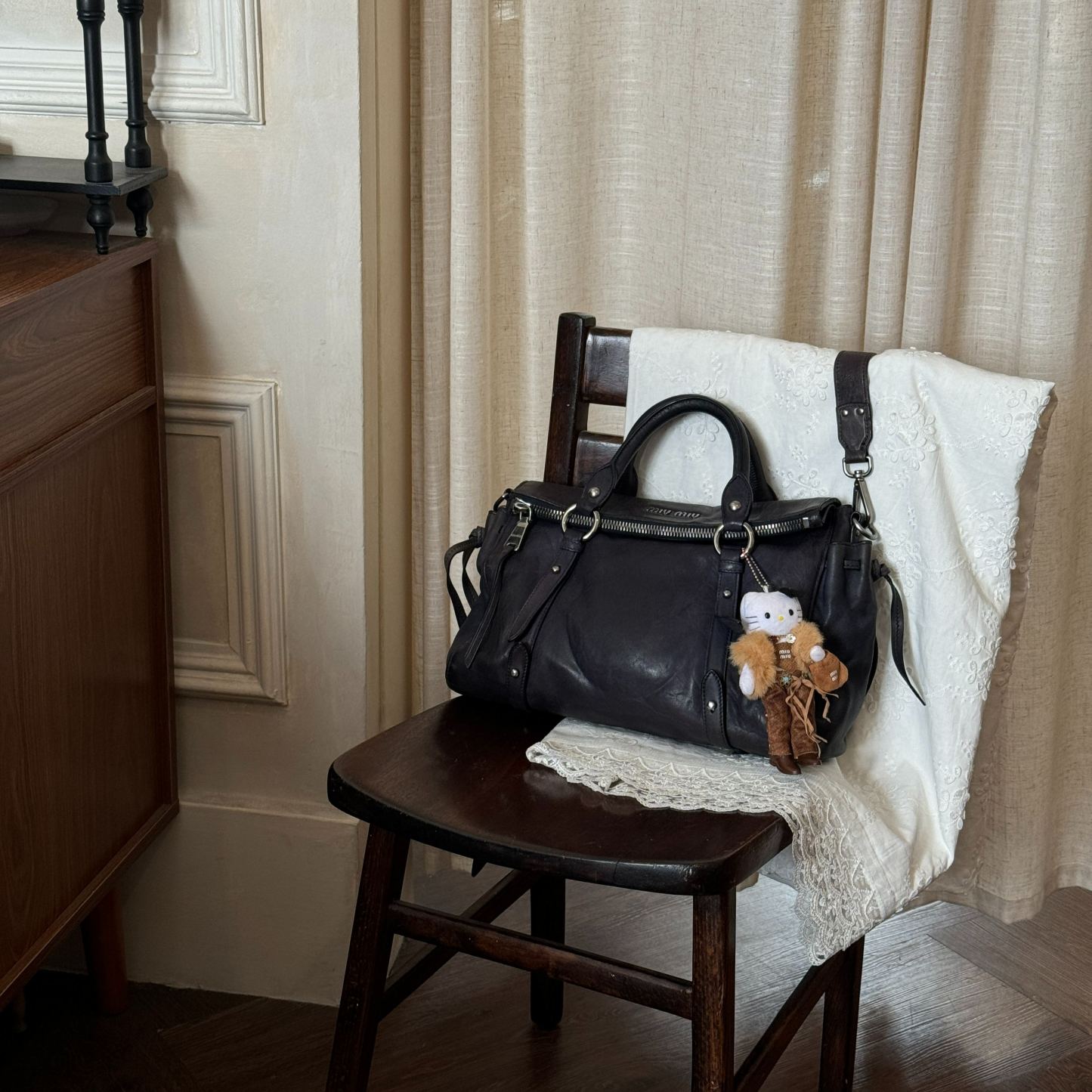 M Black and silver motorcycle bag