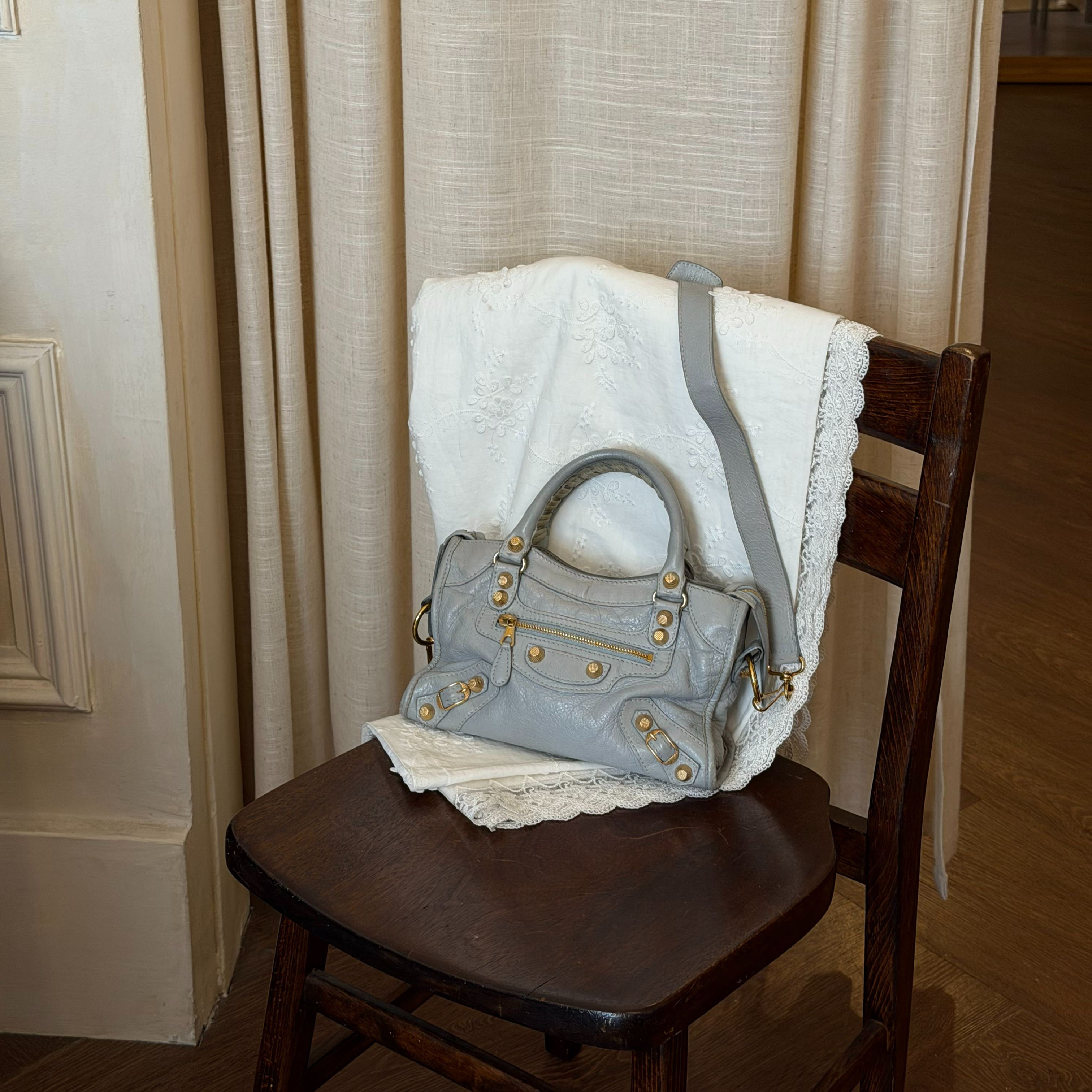 B Blue-gray studded mini motorcycle bag