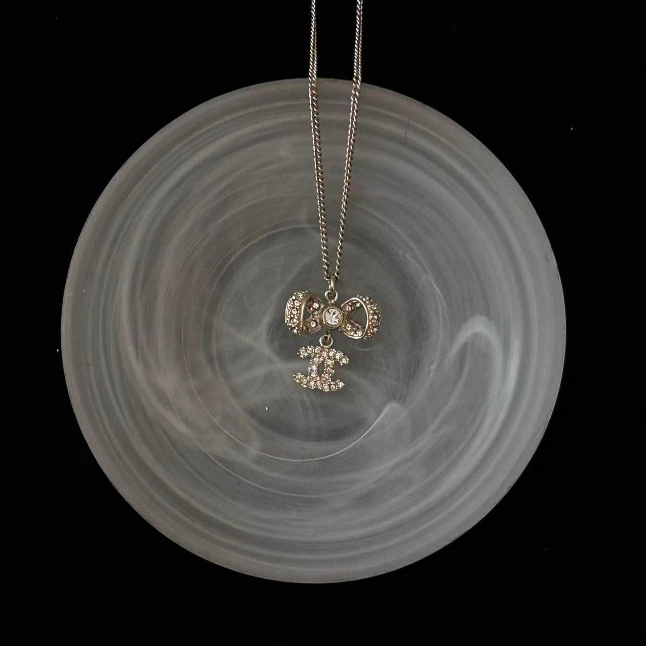 C Diamond bow necklace