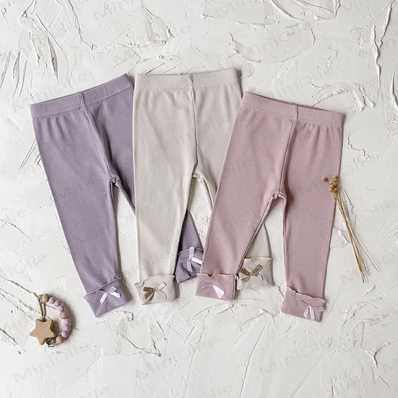 Leggings tinta unita con fiocco per bambina - image 1