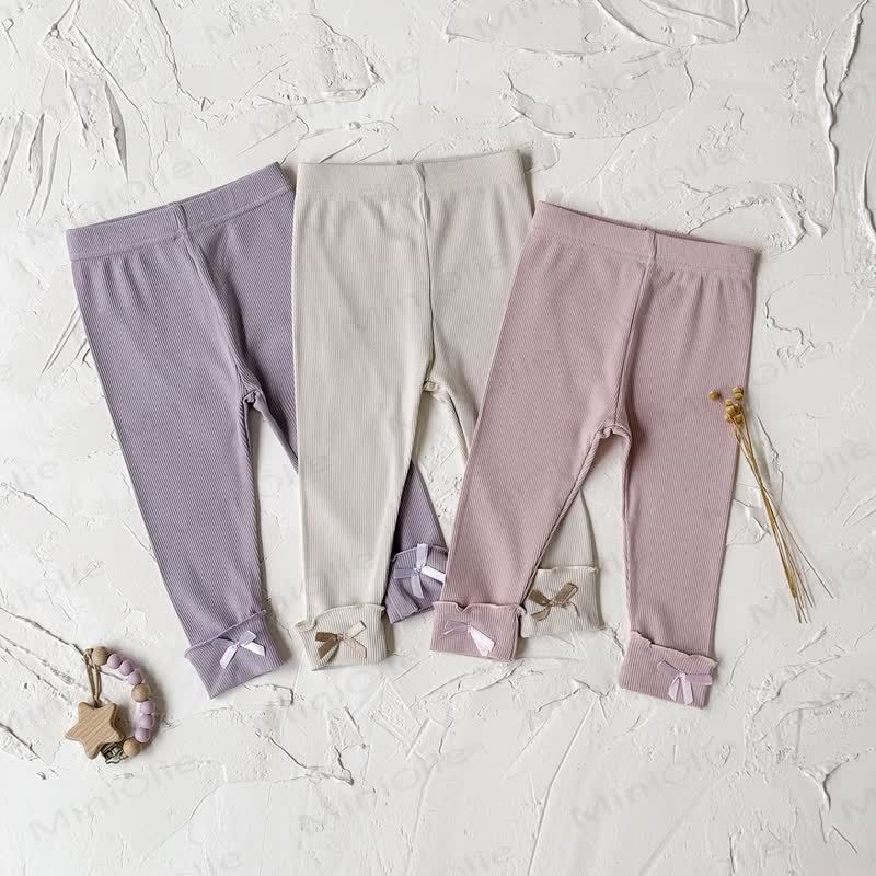 Leggings tinta unita con fiocco per bambina - image 1