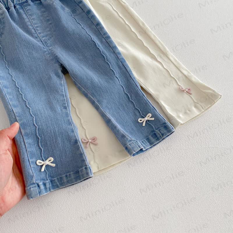 Pantaloni in denim tinta unita con fiocco per bambina - image 4