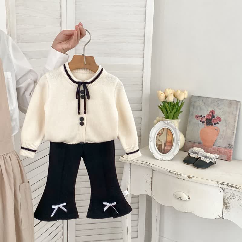 Cardigan con fiocco in maglia per bambina/pantaloni neri/pantaloni a righe - image 1