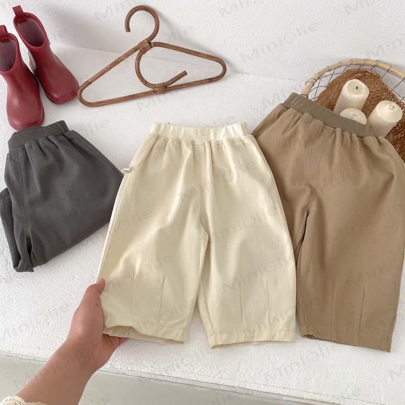 Pantaloni tinta unita con orlo per neonati e bambini - image 3