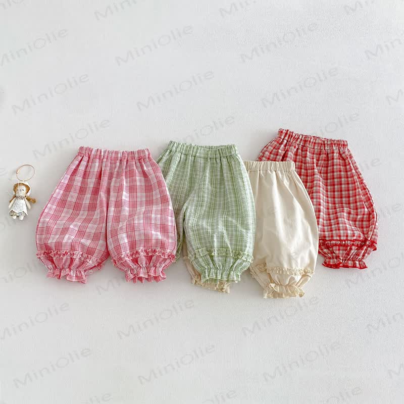 Pantaloni a quadri per bambina - image 1