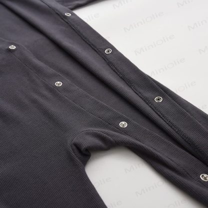 Tutina a coste tinta unita per neonati con piedini - image 9