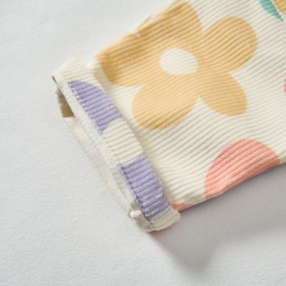 Pantaloni a fiori colorati per neonati e bambini - image 3