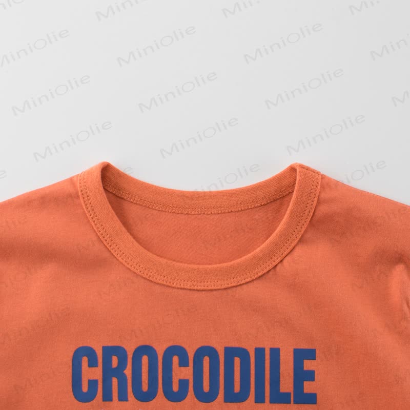 Maglietta arancione per bambino con stampa coccodrillo - image 3