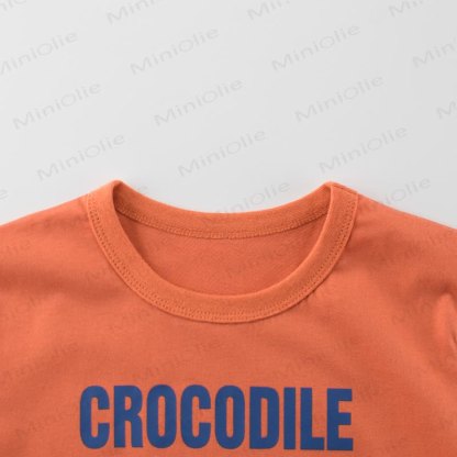 Maglietta arancione per bambino con stampa coccodrillo - image 3