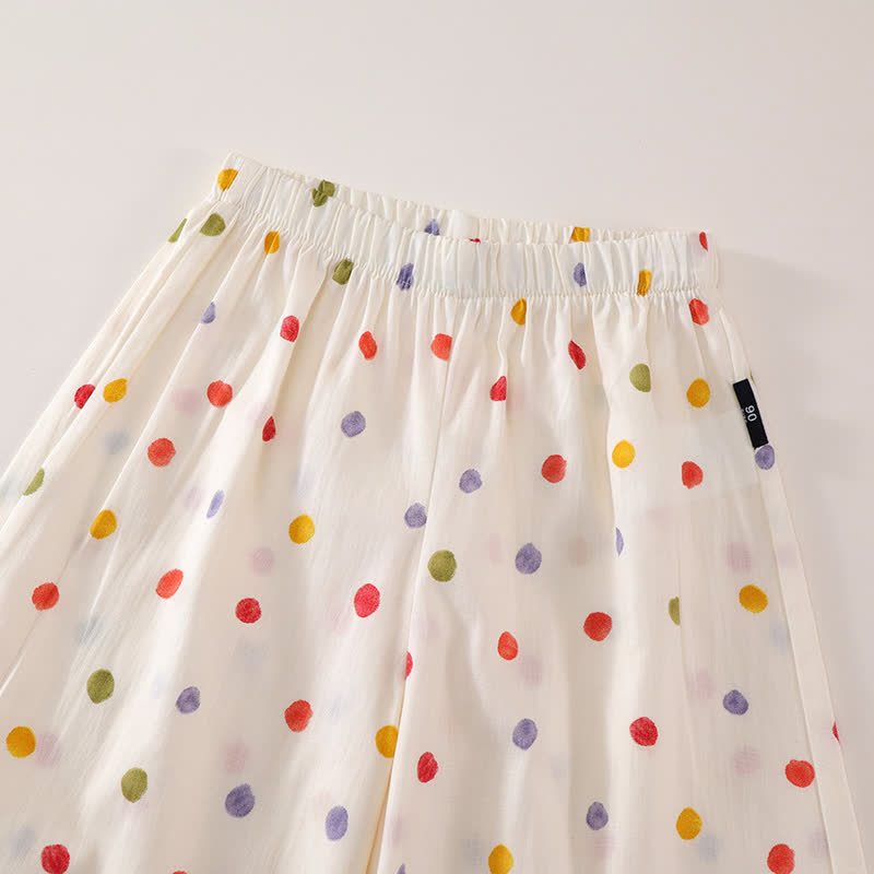 Completo da bambina con top e pantaloni beige a pois. - image 3