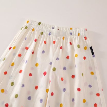 Completo da bambina con top e pantaloni beige a pois. - image 3