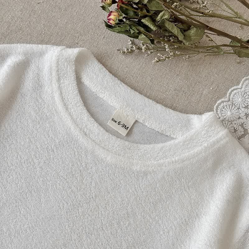 Completo baby in spugna con top corto e pantaloncini a quadri. - image 2