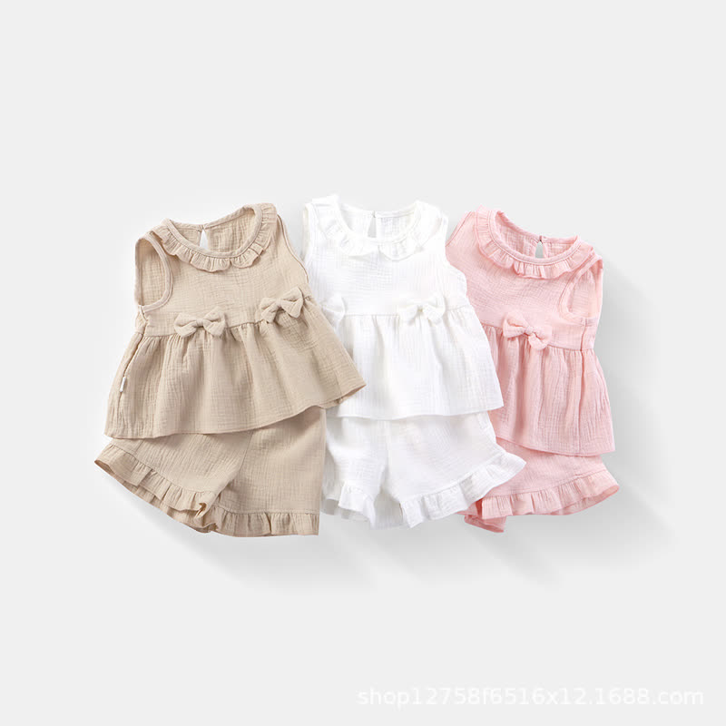 Completo da bambina composto da canotta e pantaloncini in cotone a tinta unita con volant. - image 1