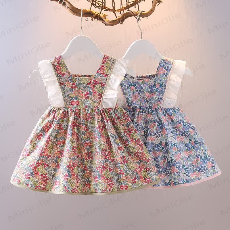 Vestitino senza maniche in cotone con fiocco e stampa floreale per bambina. - image 4