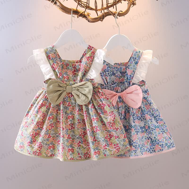 Vestitino senza maniche in cotone con fiocco e stampa floreale per bambina. - image 1