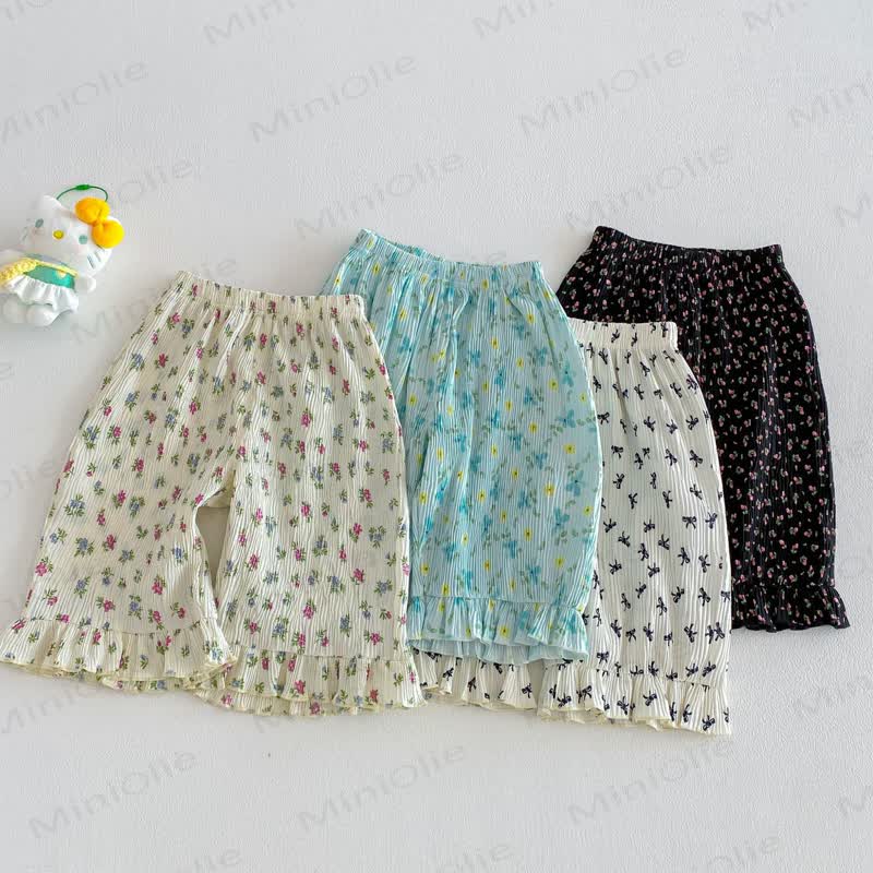 Pantaloni per neonate con stampa floreale o a fiocchi - image 1