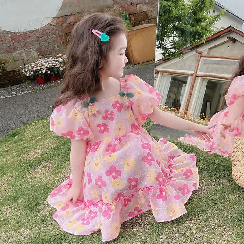 Vestito da bambina in cotone con stampa floreale rosa o verde - image 1