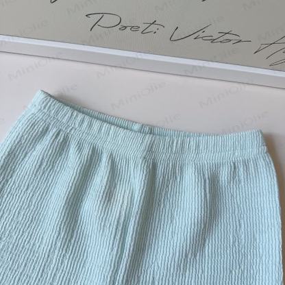 Completo per bambina composto da canotta senza maniche con fiocco in pizzo e pantaloni. - image 6