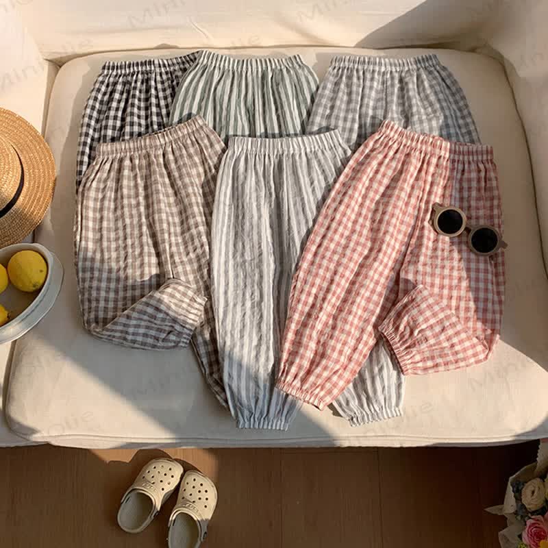 Pantaloni da bambino in cotone a righe o a quadri - image 1