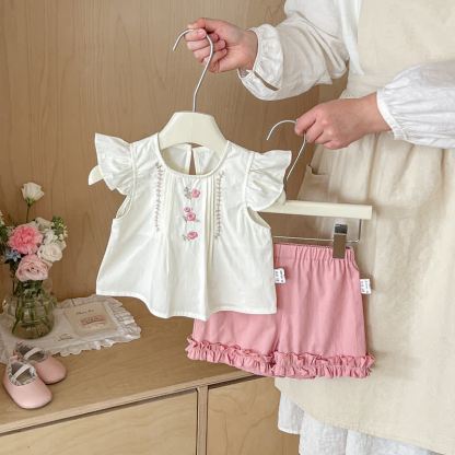 Completo due pezzi composto da top senza maniche e pantaloncini rosa chiaro con stampa floreale. - Rosa - 20-30 milioni - image 1