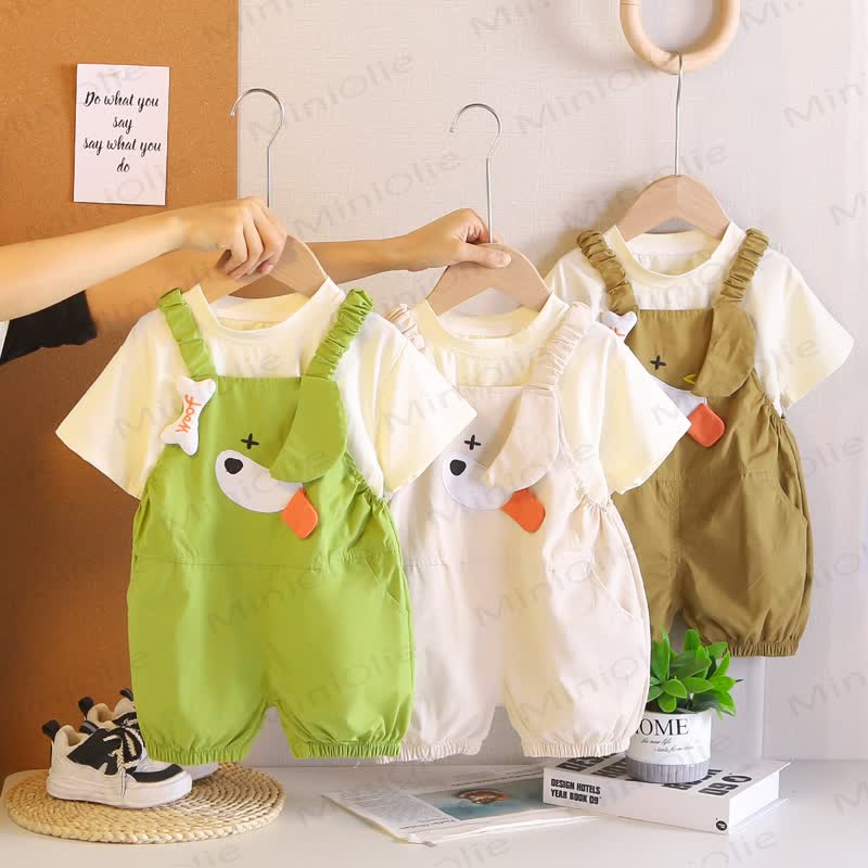 Completo da bambina composto da salopette con volant e maglietta con stampa di paperelle. - image 1