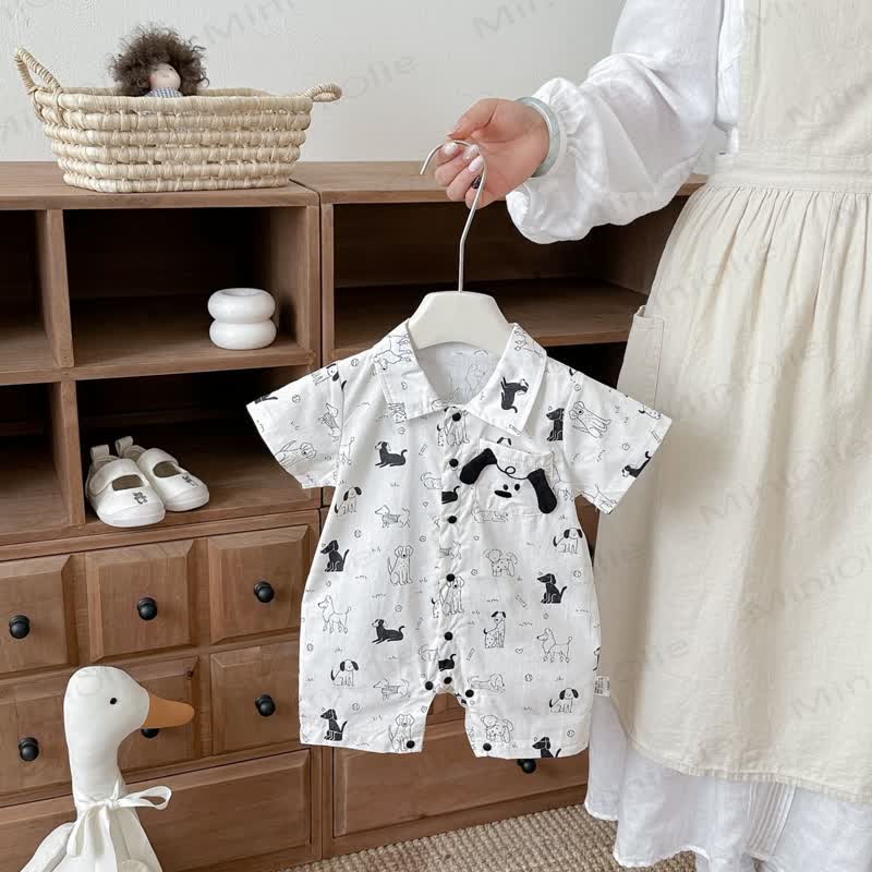 Tutina bianca da neonato con stampa di cuccioli - image 1