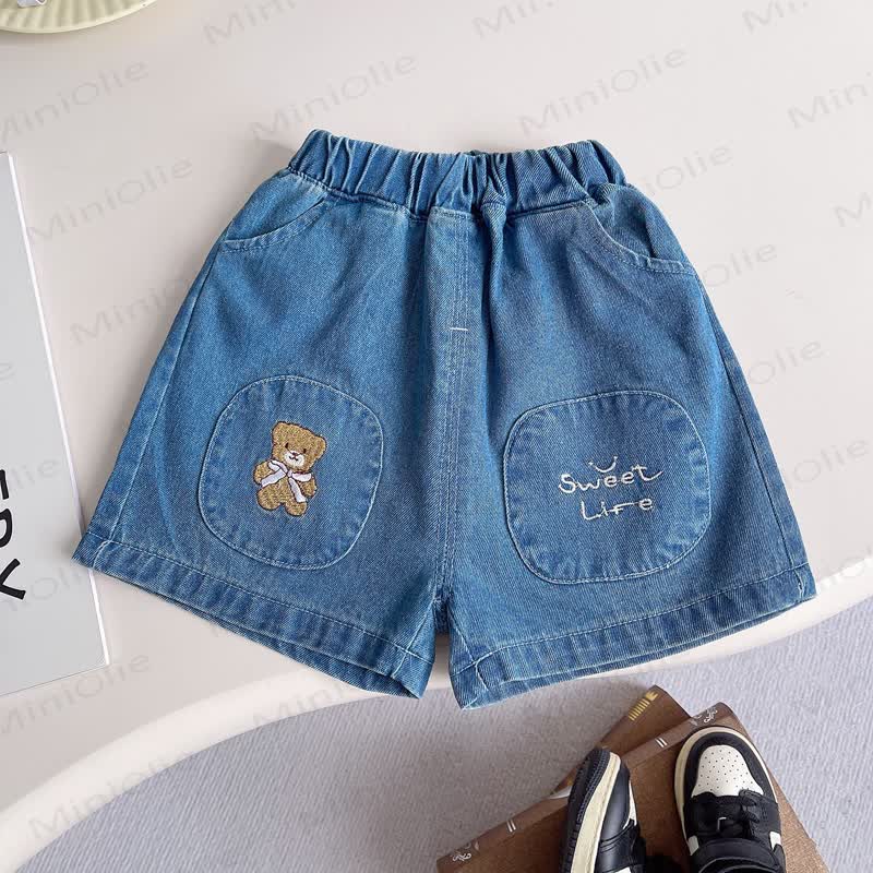 Completo da bambino composto da maglietta a righe e pantaloncini di jeans. - image 8