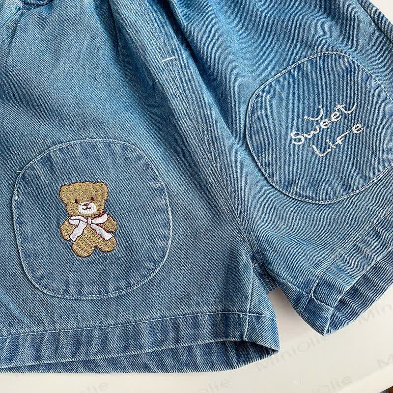 Completo da bambino composto da maglietta a righe e pantaloncini di jeans. - image 10