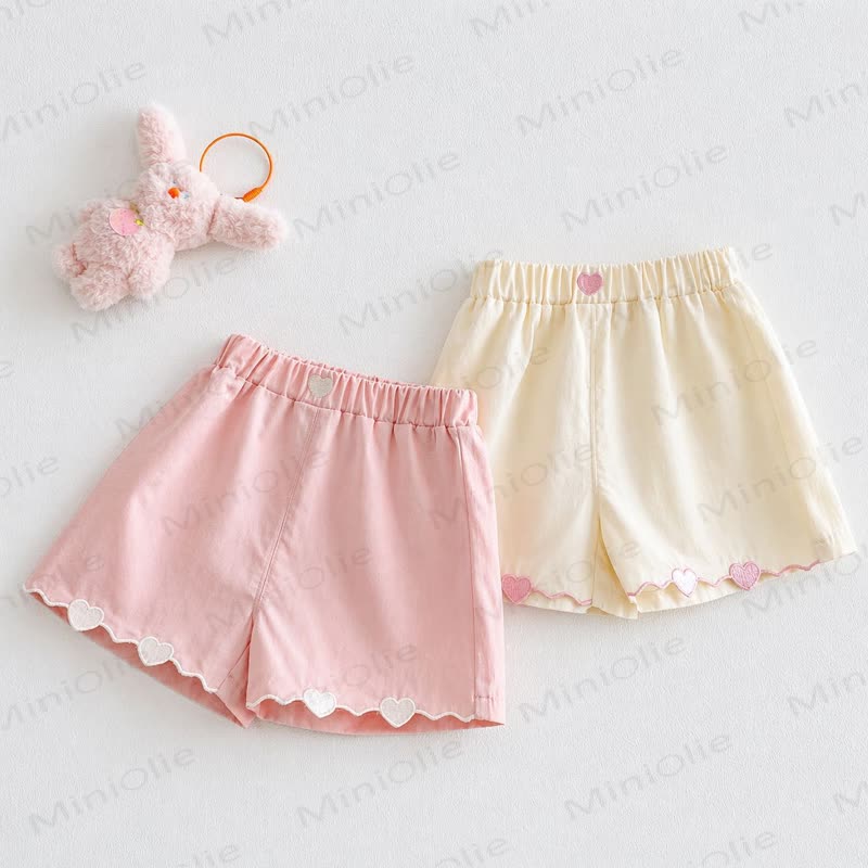 Pantaloncini da casa per bambine a tinta unita con bordo a cuoricini - image 1