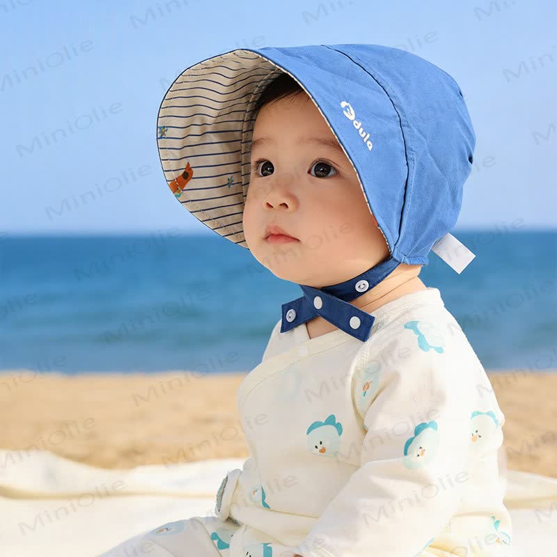 Cappellino reversibile per neonati con protezione solare - image 1