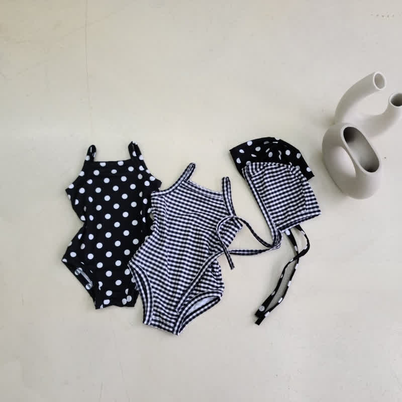 Costume da bagno intero a quadri o a pois per bambina con cuffia inclusa. - image 1