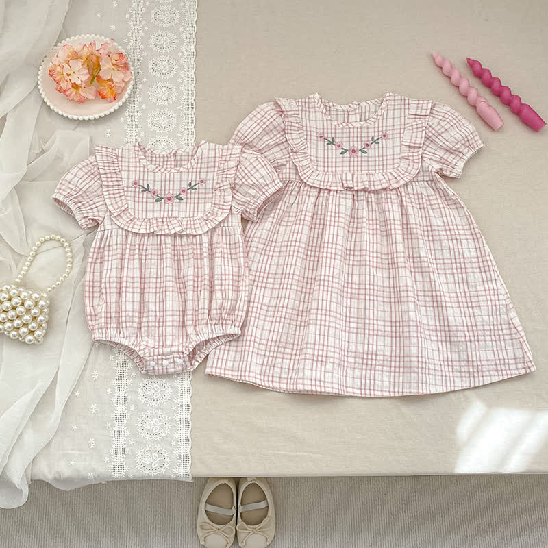 Vestitino/body per bambina a quadretti rosa con stampa floreale - image 1