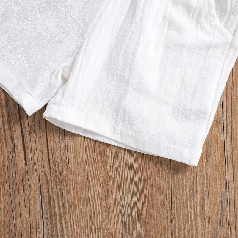 Completo da bambino in cotone e lino, composto da polo e pantaloncini in tinta unita. - image 7