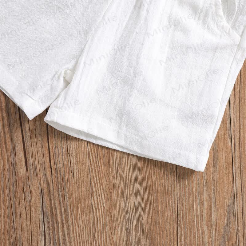 Completo da bambino in cotone e lino, composto da polo e pantaloncini in tinta unita. - image 7