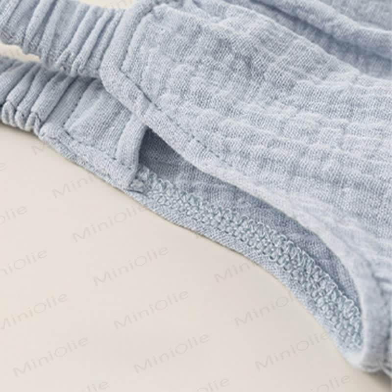 Tutina in cotone azzurro stropicciato con ricami color pesca e tasche. - image 4